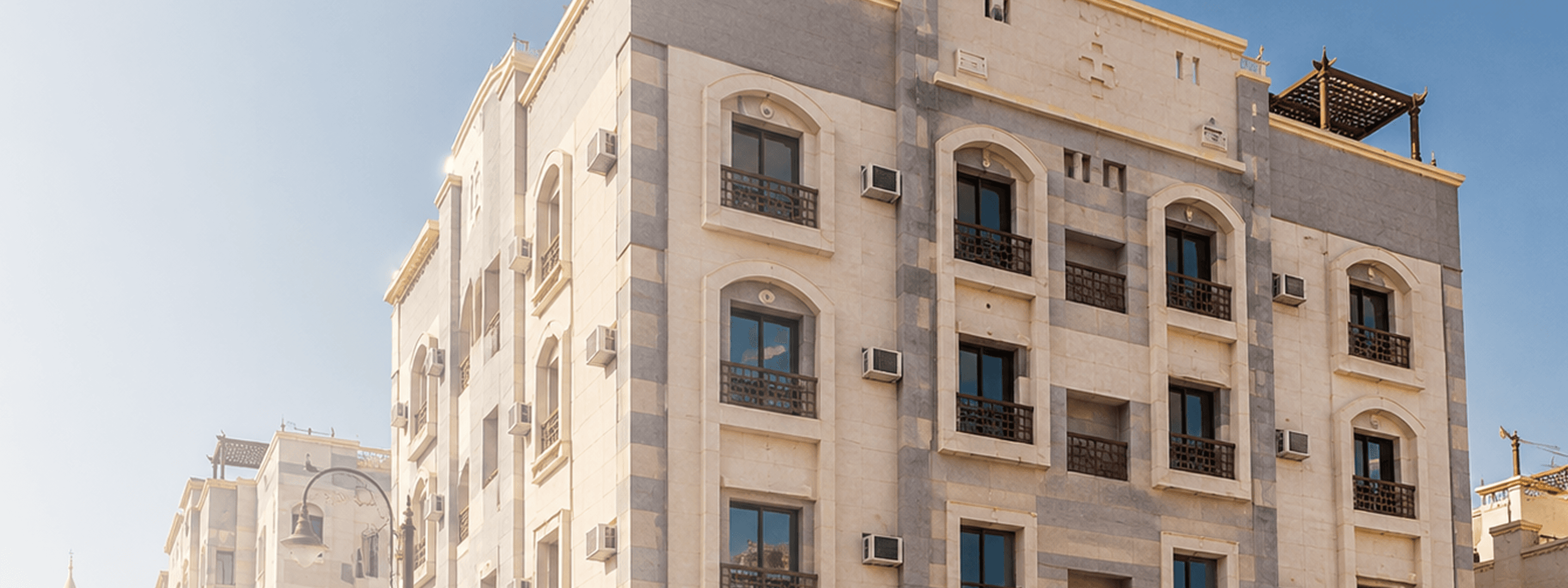 The Madinah Residence facade at golden hour